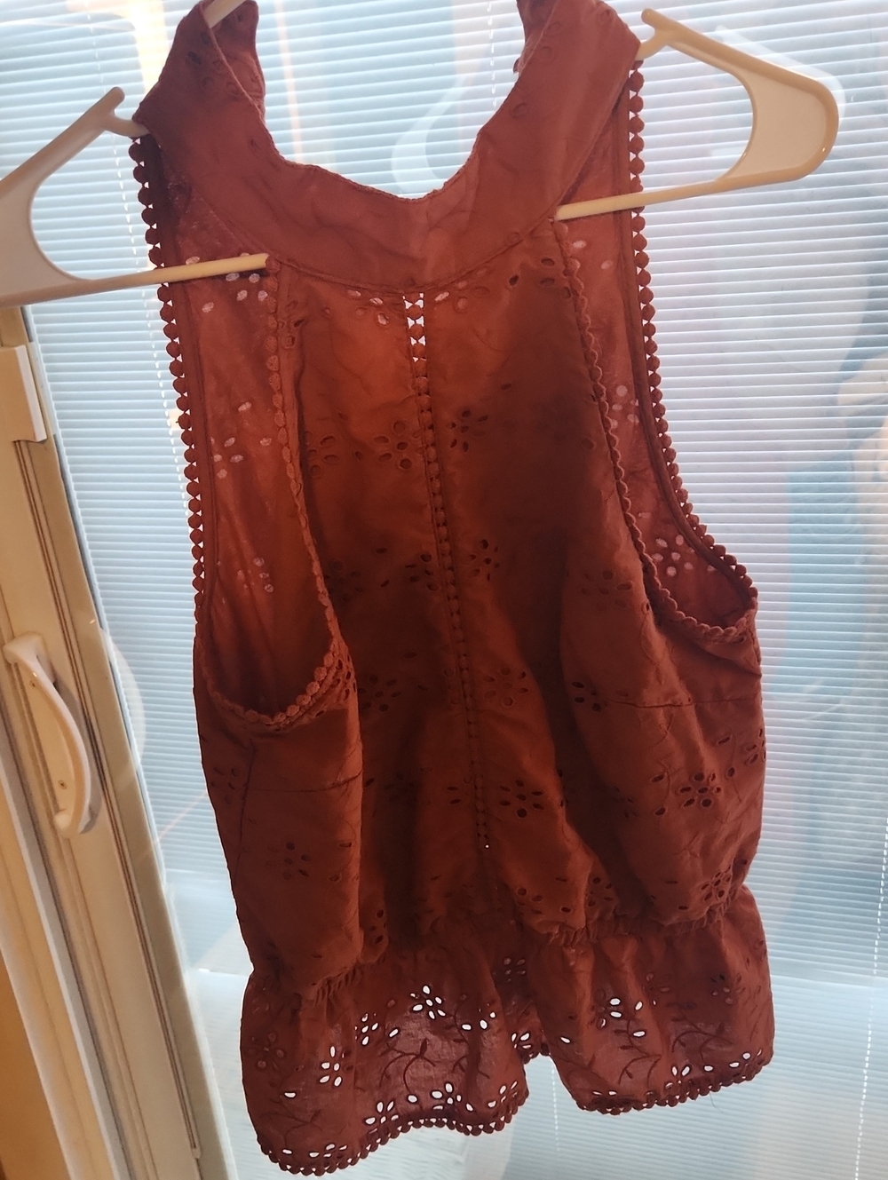 Sleeveless Eyelet Peplum Blouse in Rust Brown